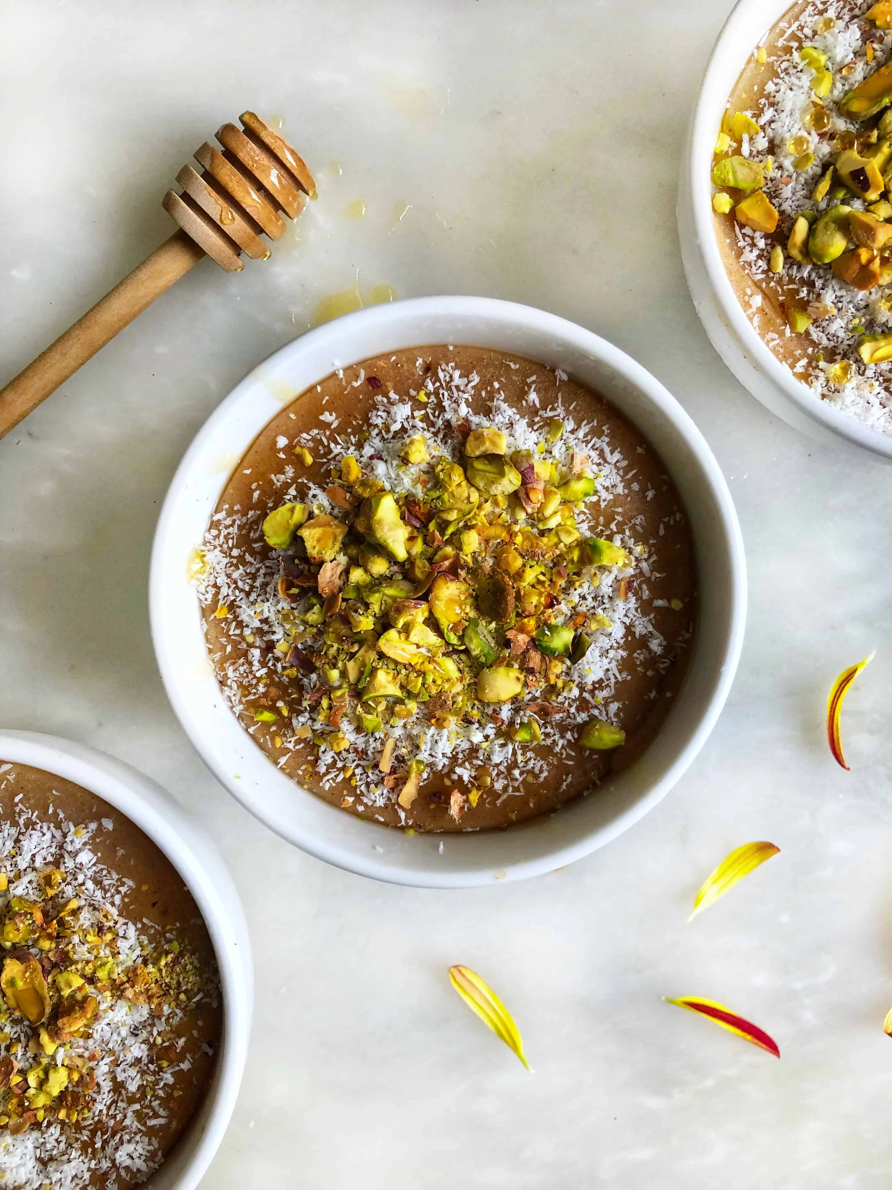 spiced rice pudding topped with pistachios and coconut