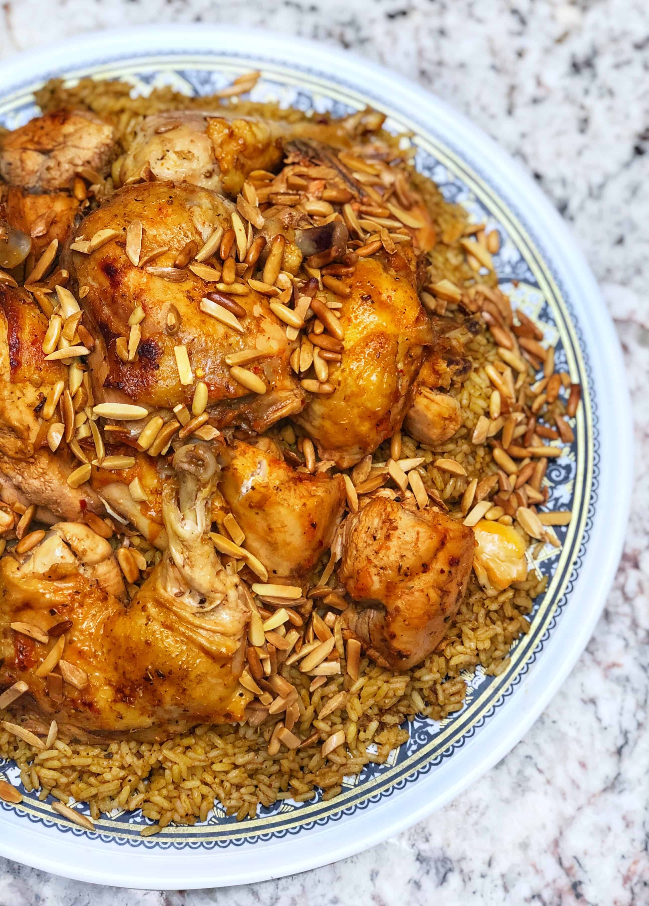 kabseh with roasted chicken on top
