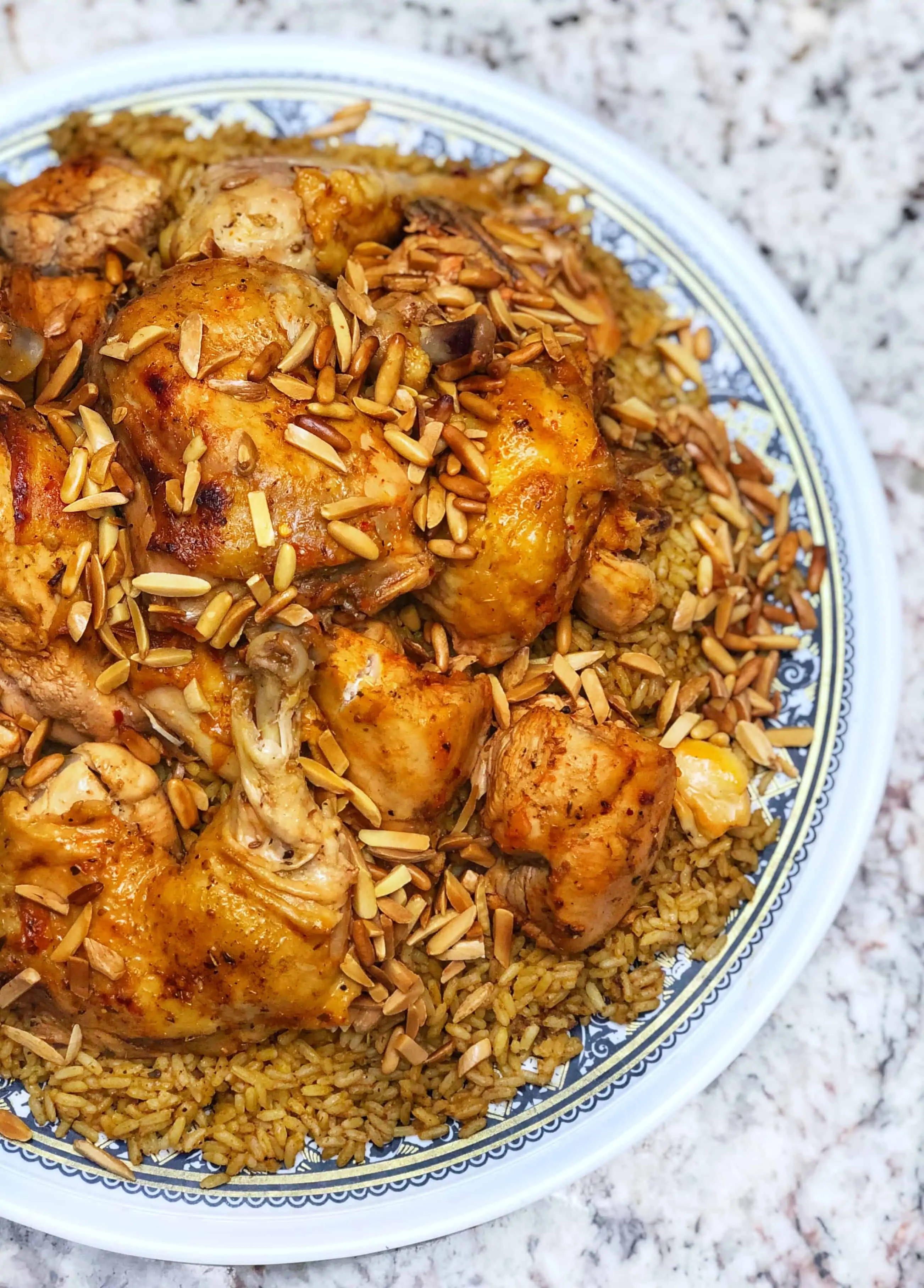 kabseh with roasted chicken on top