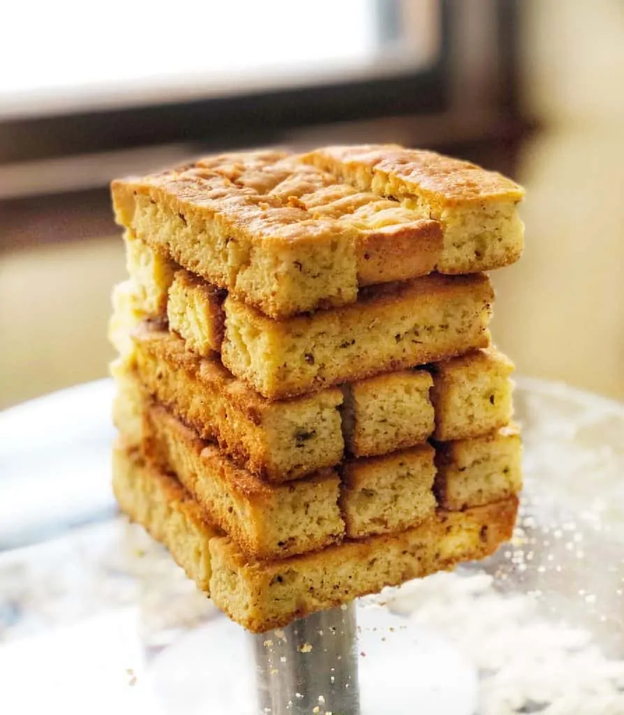 anise biscotti stacked in a jenga tower