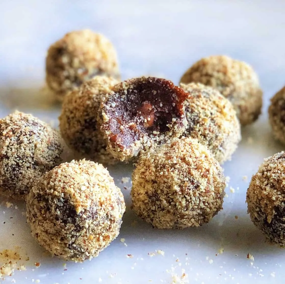 Chocolate Almond Date balls with one cut in half