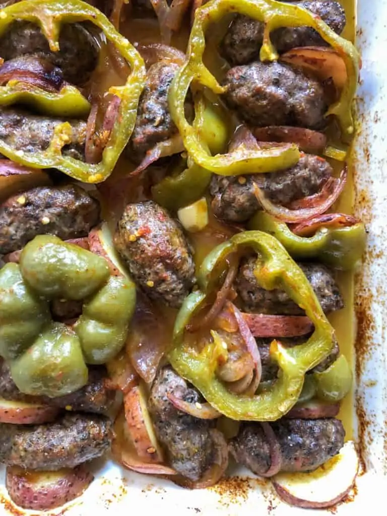 middle eastern baked kufta with green peppers on top