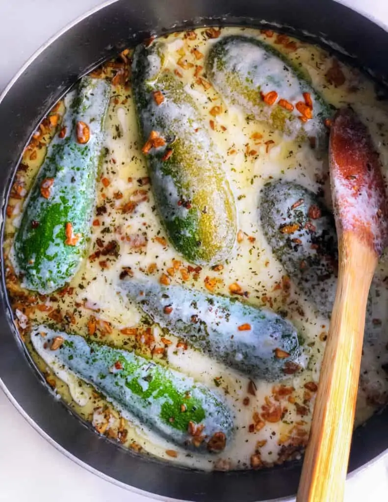 Kousa Mashi Bil Laban (Stuffed Zucchini in Yogurt) with sautéed garlic mixed into it