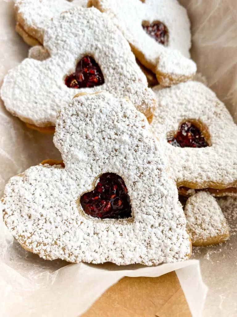 linzer cookies close up showcasing the jam in the center