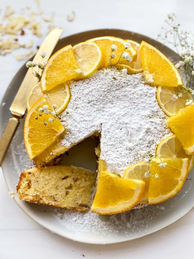 sliced citrus olive oil cake showcasing the inside of the cake