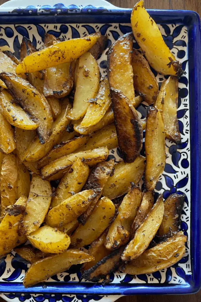 mediterranean style potatoes on a decorative plate