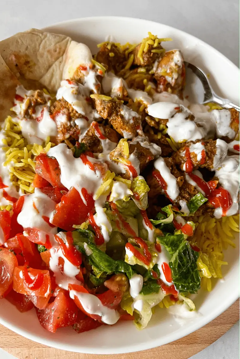 close up of halal cart chicken with rice and sauce