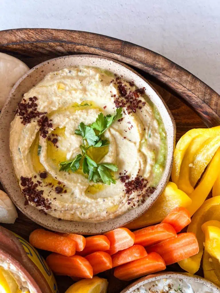 easy and authentic recipe for hummus on a mezze platter with vegetables