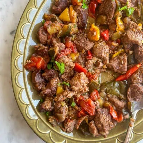 Baked Lamv and Veggies on a green serving platter