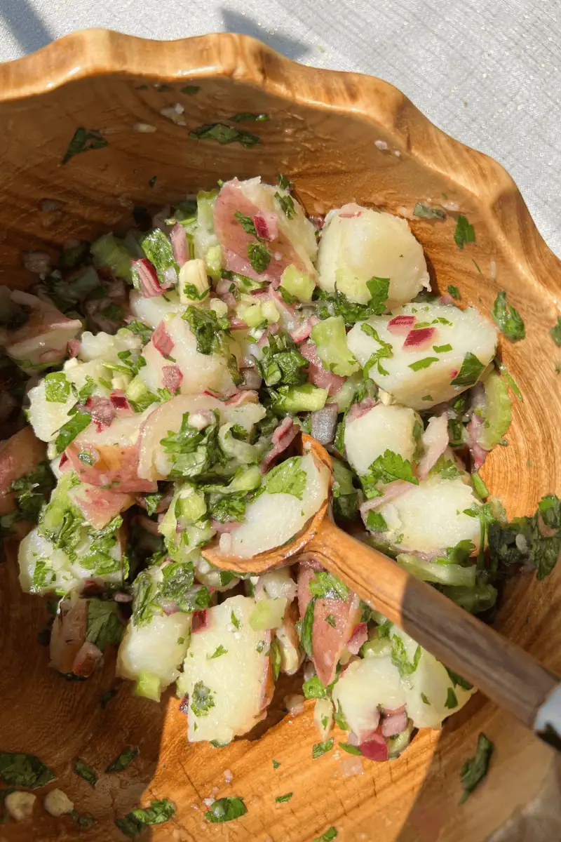 Herby Potato Salad in a wooden bowl