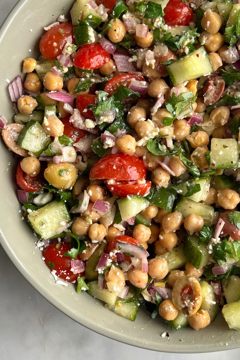 Mediterranean Chickpea Salad closeup with chickpeas, cucumbers, tomatoes, feta and onion