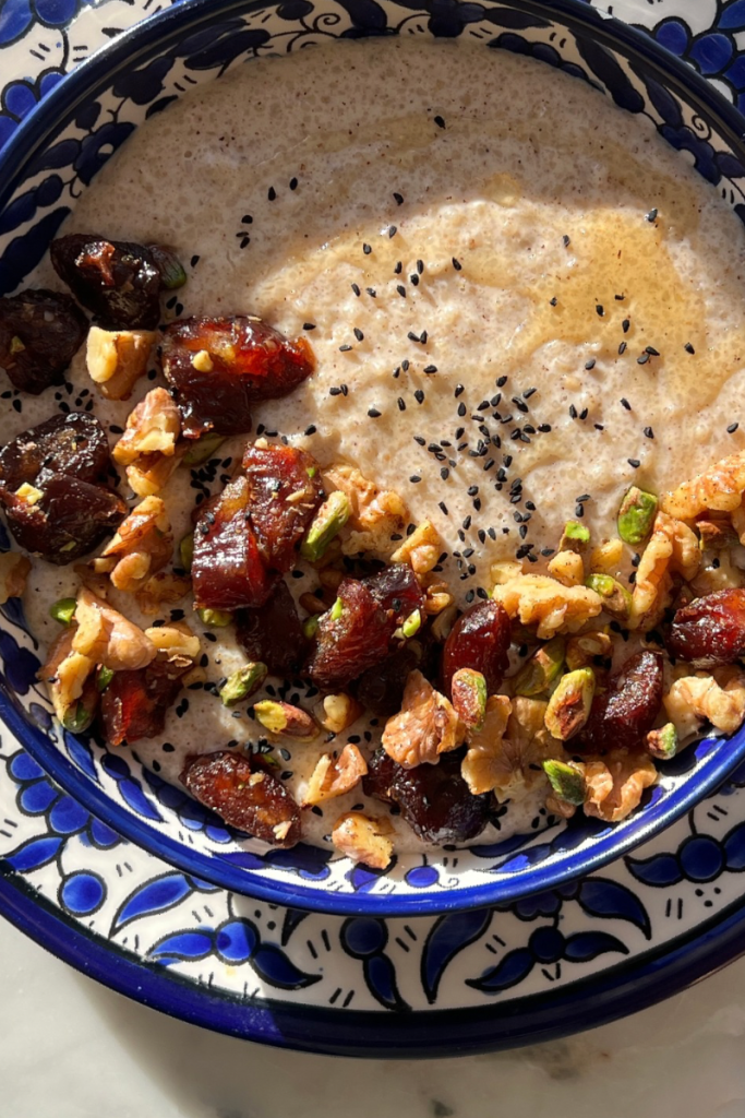 Talbina topped with dates. nuts, nigella seeds and honey